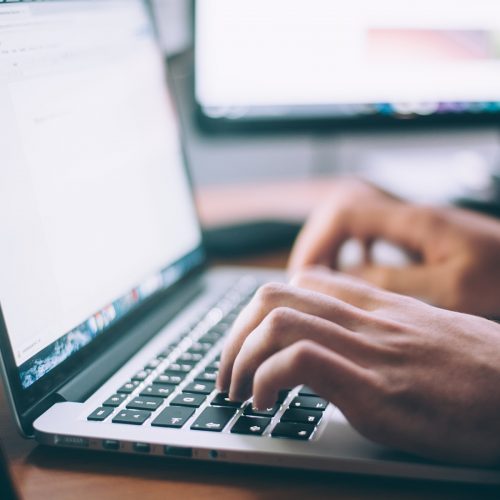 Hands at a laptop